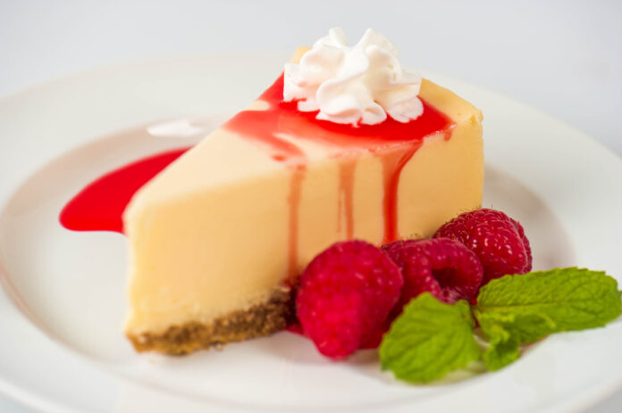 feature.web Dakota's Favorite Cheesecake - Cheesecake with a Raspberry and Sour Cream topping