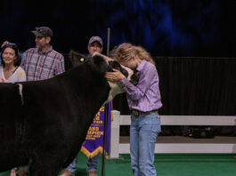 Ryleigh Egbert and her Grand Champion Market Beef Steer