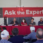 Farm Science Review: Farm incomes strong; inflation, inputs are challenges four people speak from a stage