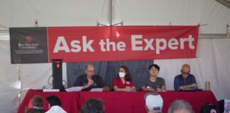 Farm Science Review: Farm incomes strong; inflation, inputs are challenges four people speak from a stage