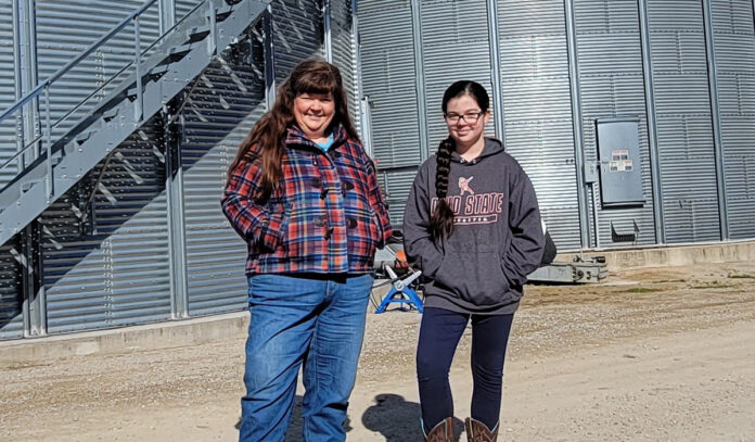 Marcia and Mae Ruff Marcia and Mae Ruff stand in front of grain containers, Feb. 11. The containers were built in partnership with Farmers Business Network.
