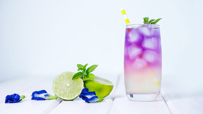Butterfly pea flower drink with lime , honey and mint leaf , a f