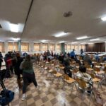 EPA expands soil testing on farms around train derailment site people sitting at chairs facing away from the camera with a floor