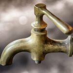 Conserving water helps home sewage treatment systems last faucet