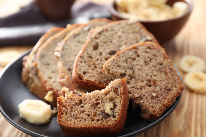 Sliced banana bread with nuts on plate