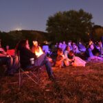 The Pig Lady and other folk tales show why recording stories matters people sit in lawn chairs and on the ground, bathed in light from campfires