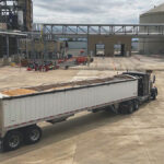 Ohio’s soybean processing capacity is growing a tractor trailer full of soybeans drives at an angle into a soybean plant
