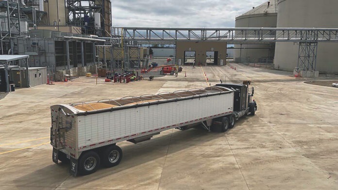 cargill sidney a tractor trailer full of soybeans drives at an angle into a soybean plant