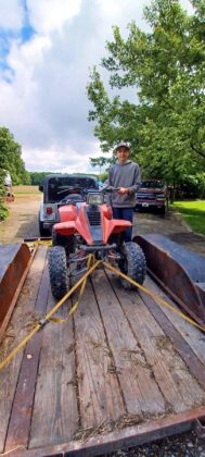 Daniel loading 4-wheeler on trailor