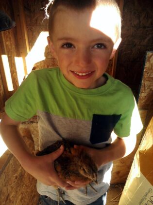 Daniel with a chicken