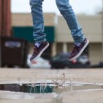 Memories of simple childhood joys jumping in a puddle
