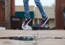 Memories of simple childhood joys jumping in a puddle