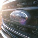 Ohio man sentenced for disabling emissions controls on diesel trucks a close up of the grille of a ford truck