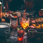 Gathering of the Species person trying to pick fried food