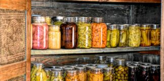 Doing the harvest time hustle a wooden shelf filled with lots of jars of food